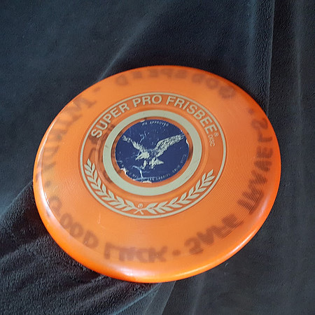 See Descriptor..Mindy Ahler, Lightnin' Lyle— Super Pro—"Bike Across America" Travel Disc—Orange