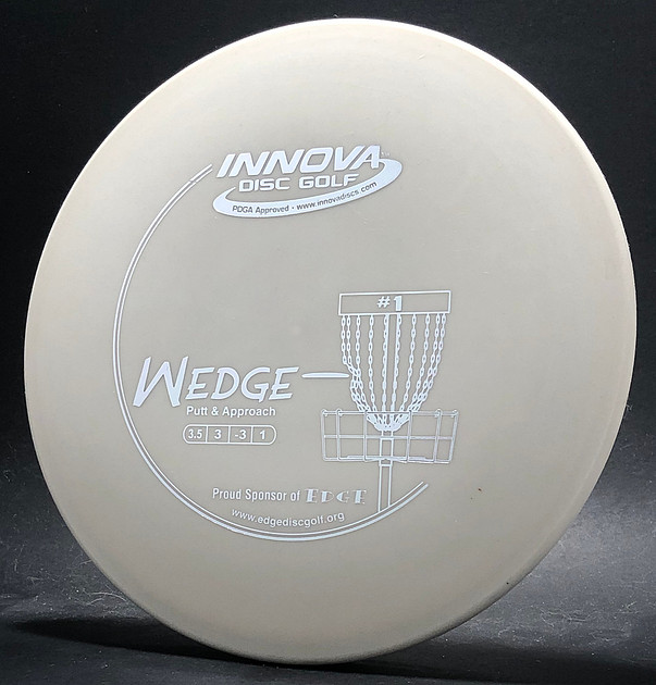 Wedge Disc Flying Disc Museum | T–Z Molds | Wedge, DX—Swoosh—White—Silver